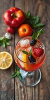 Bright and refreshing cocktail garnished with fresh berries and citrus fruits on a rustic wooden table photo