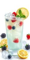 Refreshing summer beverage with mixed berries and lemon garnishes served in a tall glass photo