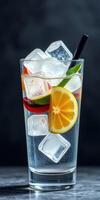 Refreshing cocktail served in a tall glass with ice, lemon, and lime slices, perfect for summer gatherings photo