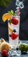 Refreshing summer drink with mixed berries and citrus served over ice in a tall glass photo