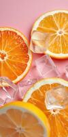 Refreshing orange slices with ice cubes on a pink background create a vibrant summer vibe photo