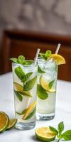 Refreshing mint lemonade served in tall glasses with lime and mint at a cozy cafe during summer afternoon photo