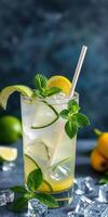 Refreshing cocktail with mint and citrus served on a cool surface with ice photo