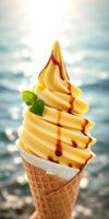 Delicious ice cream cone with caramel drizzle enjoyed by the sea photo