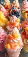 Colorful fruit sorbets topped with whipped cream and fresh berries in dessert cups at a summer event photo