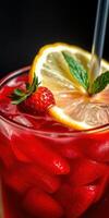 Refreshing summer drink with strawberries and lemons garnished with mint leaves in a glass filled with ice photo
