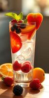 Refreshing fruit cocktail with vibrant colors served in a tall glass during a sunny afternoon photo