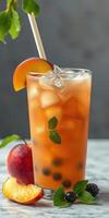 Refreshing iced drink made with fruit and berries on a marble surface with fresh ingredients nearby photo