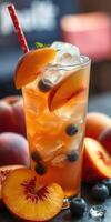 Refreshing summer drink featuring peaches and blueberries on a warm afternoon photo