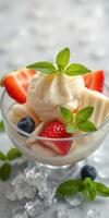 Delicious dessert bowl with creamy ice cream topped with fresh strawberries and blueberries photo