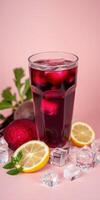 Refreshing beetroot lemonade served with ice and lemon slices in a vibrant setting photo