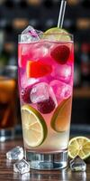 Refreshing drink with vibrant colors and fresh fruits served in a tall glass on a bar counter photo