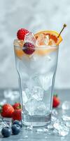 Refreshing summer drink with berries and orange garnish served in a tall glass with ice photo