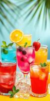 Vibrant array of colorful cocktails adorned with fruits and herbs in a tropical setting photo