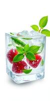 Refreshing strawberry and mint cocktail with ice cubes in a clear glass at a summer gathering photo