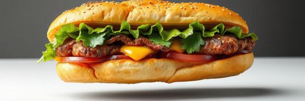 Juicy burger with lettuce, tomato, and cheese on a plain background highlighting its deliciousness photo
