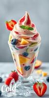 Delicious cold dessert with colorful fruit and creamy topping served in a tall glass photo
