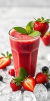 Refreshing berry smoothie served in a tall glass with fresh strawberries and mint leaves in a bright setting photo