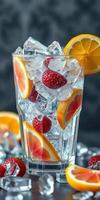 Refreshing summer drink with ice, strawberries, and citrus slices in a tall glass photo
