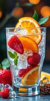 Refreshing summer beverage with strawberries and oranges served over ice in a glass photo