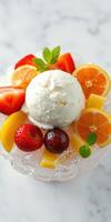 Delicious ice cream topped with fresh fruits on a marble surface photo