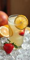 Refreshing lemonade with strawberries and lemon slices on ice near fresh fruits in a bright setting photo