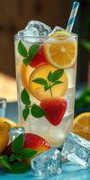 Refreshing summer beverage with strawberries, lemons, and mint on a sunny day photo