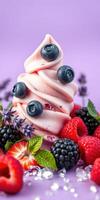 Delicious soft serve ice cream topped with fresh berries and mint leaves on a purple background photo
