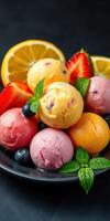 Colorful assortment of fruit-flavored sorbets with fresh berries and mint on a dark background photo