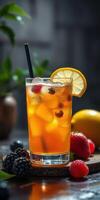 Refreshing fruit drink garnished with lemon and berries on a dark countertop during a cozy indoor gathering photo