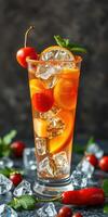 Refreshing fruit cocktail with cherry and citrus garnishes served in a tall glass photo