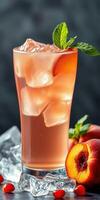 Refreshing peach drink served with ice cubes and mint leaves in a glass with fresh peaches on a dark background photo