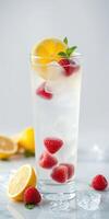 Refreshing raspberry lemon beverage served with ice and mint, perfect for summer days photo