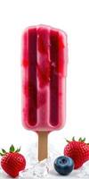 Colorful fruit popsicle surrounded by fresh strawberries and blueberries on ice photo