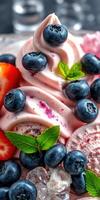 Delicious dessert featuring creamy swirl with blueberries and strawberries garnished with mint leaves photo