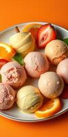 Colorful assortment of ice cream scoops with fresh fruits on a vibrant plate photo