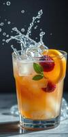 Refreshing cocktail with raspberries and orange slices splashing in a glass filled with ice photo