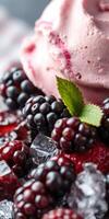Delicious dessert featuring blackberries, raspberry sauce, and creamy ice cream with mint garnish served on crushed ice photo