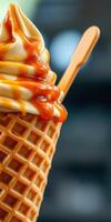 Delicious ice cream cone topped with caramel sauce in a vibrant setting photo