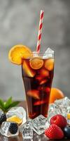 Refreshing summer beverage with citrus fruits and berries served over ice photo