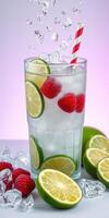 Refreshing drink with lime and raspberry garnishes served in a glass with ice on a gradient background photo
