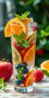 Refreshing fruit cocktail with vibrant berries and citrus, perfect for a summer day photo