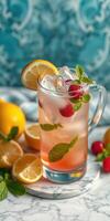 Refreshing summer beverage with lemon, raspberries, and mint on a marble surface photo