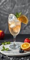 Refreshing beverage with fruits and mint on a marble surface in a bright setting photo
