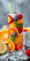 Refreshing fruit cocktail with ice and mint adorned in a tall glass photo