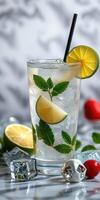 Refreshing citrus drink with mint and ice on a stylish background photo