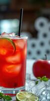 Refreshing cocktail with ice, garnished lime, and a shiny red apple on a table in a cozy setting photo