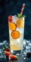 Refreshing citrus beverage topped with mint and berries, perfect for summer gatherings on a bright day photo