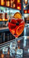Refreshing cocktail with citrus and berries served in an elegant glass at a modern bar photo