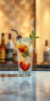 Refreshing summer cocktail with fresh fruit and mint served at a stylish bar in the late afternoon photo
